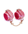 Menottes en cuir rose irisé