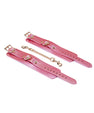 Menottes en cuir rose irisé
