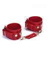 Red faux leather and gold metal handcuffs